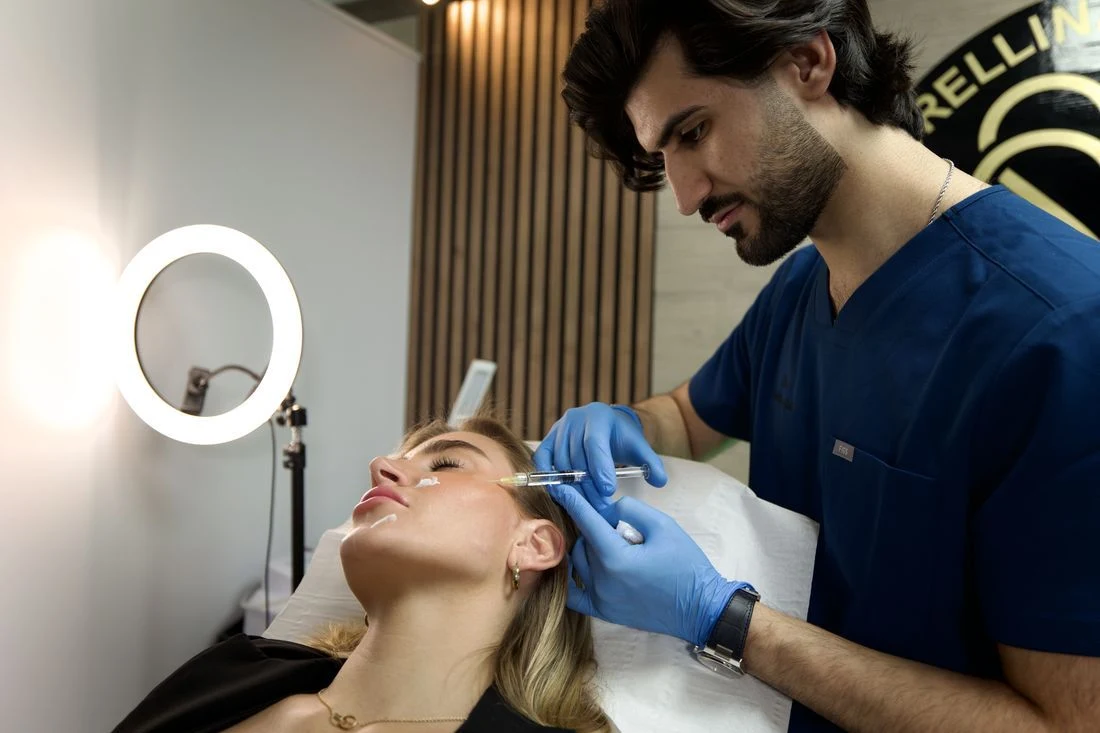 Nima performing an aesthetic treatment